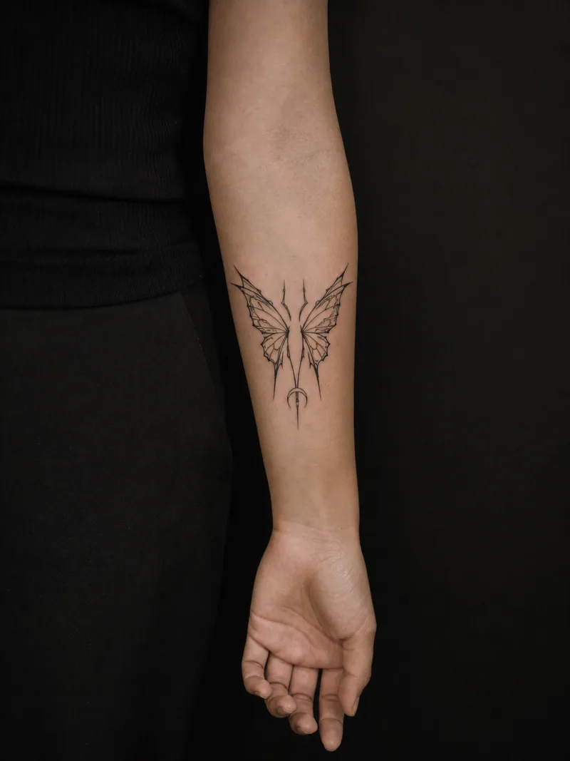 Cyber-sigil butterfly tattoo - Sharp symmetrical lines build narrow spiked wings.