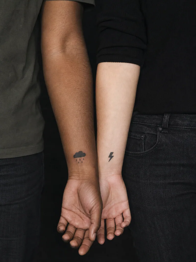 Cloud and lightning tattoos - A rain cloud and sharp bolt form a compact weather pairing.