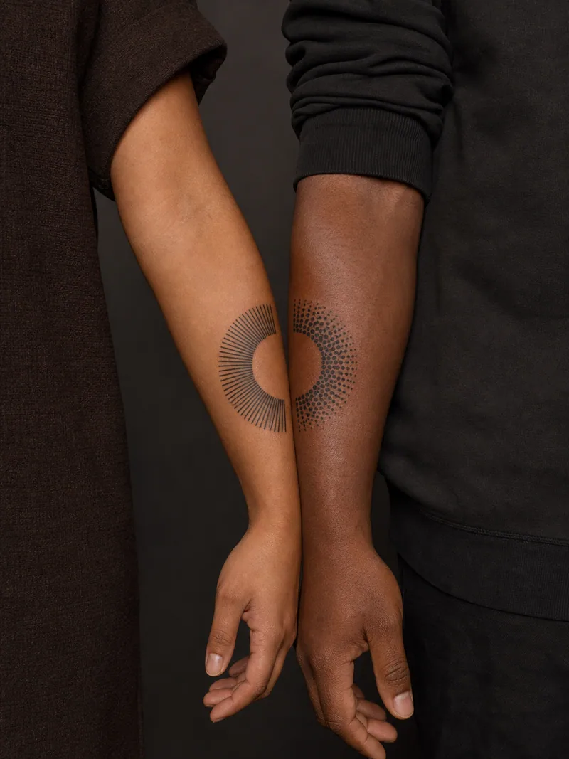 Abstract circle couple tattoos - Two patterned semicircles become one complete circle when aligned.