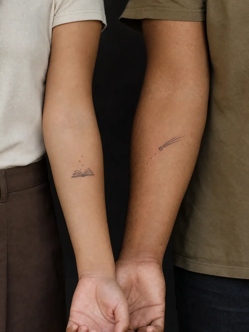 Book and comet tattoos - Dots leaving an open book continue into the path of a small comet.