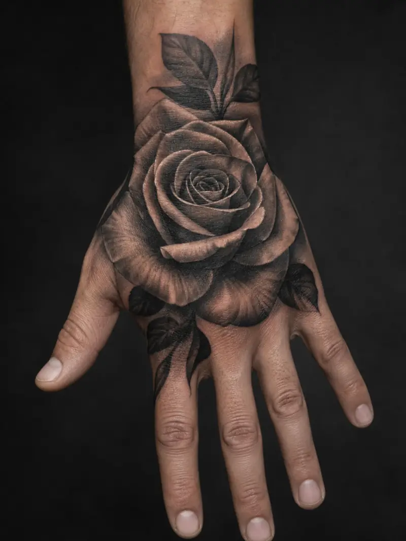 Rose tattoo on the back of a hand