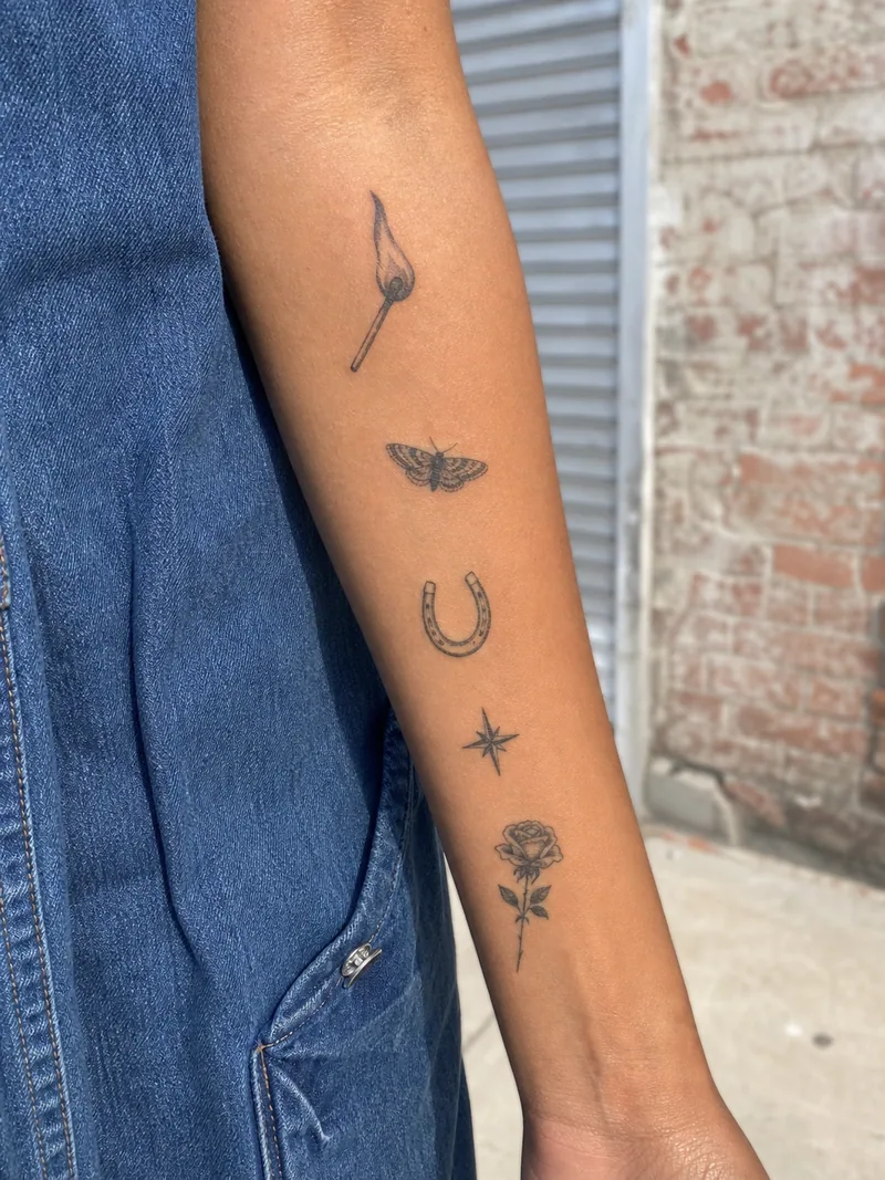 Patchwork forearm tattoos - flame, moth, horseshoe, star and rose arranged with open space
