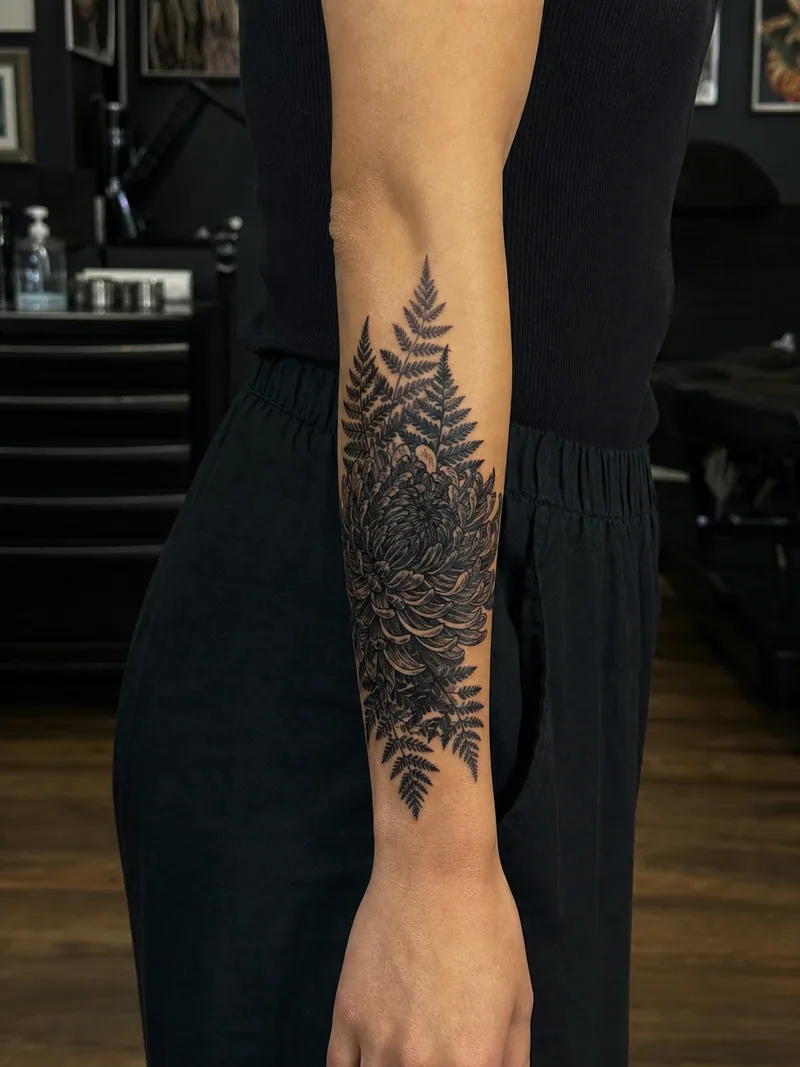 Chrysanthemum cover-up tattoo - dense chrysanthemum and ferns covering an older faded mark