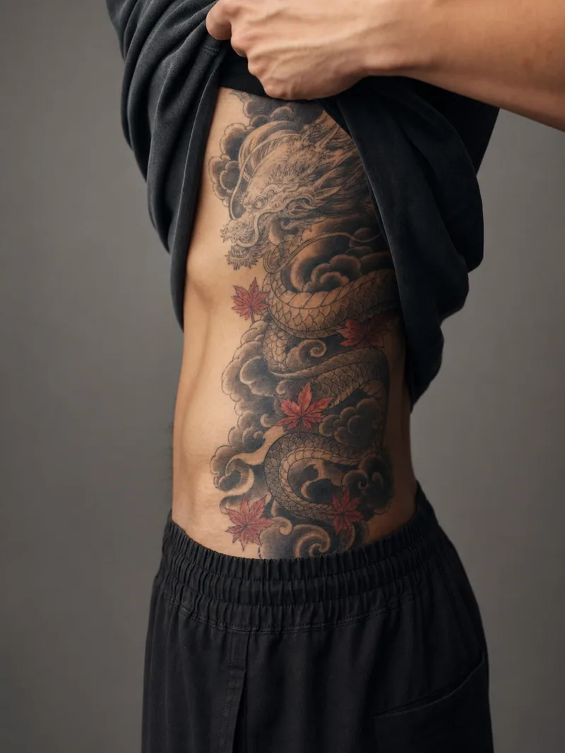 Dragon rib tattoo - dragon flowing through dark clouds and restrained red maple leaves