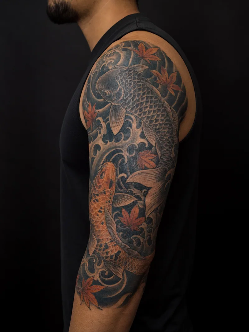 Koi half sleeve tattoo - two koi circling through layered water and maple leaves