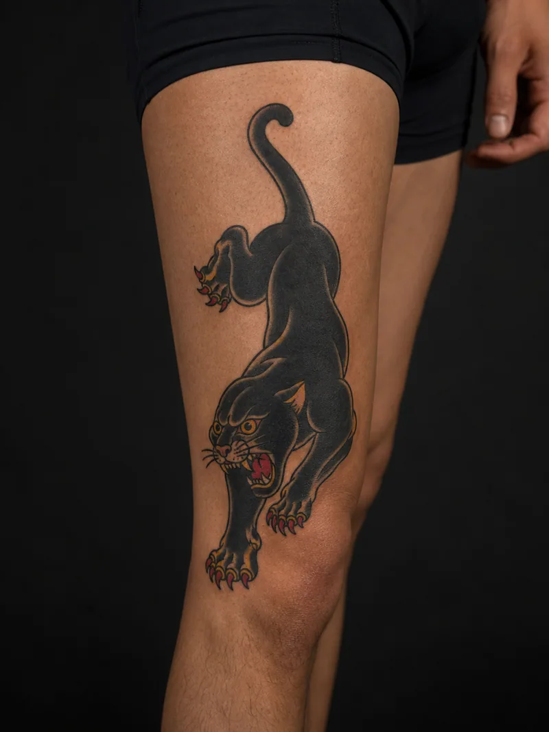 Traditional panther tattoo - a crawling panther in a bold diagonal pose with a readable silhouette