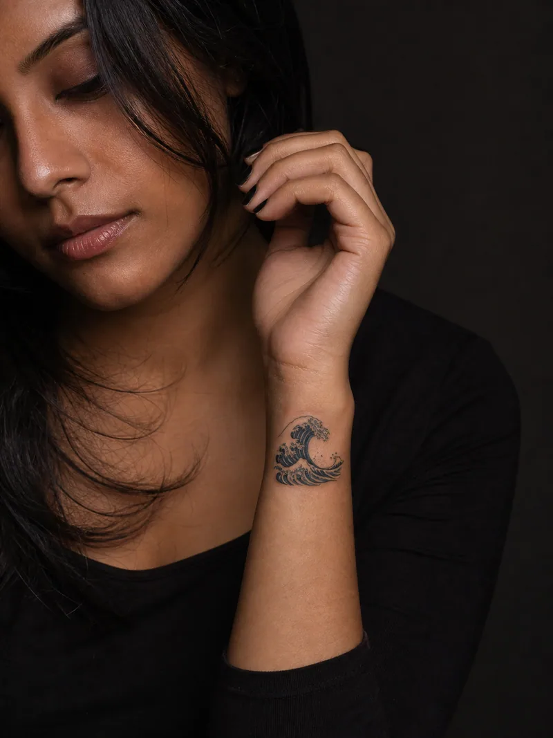 Small wave tattoo - compact curling wave with a strong readable silhouette