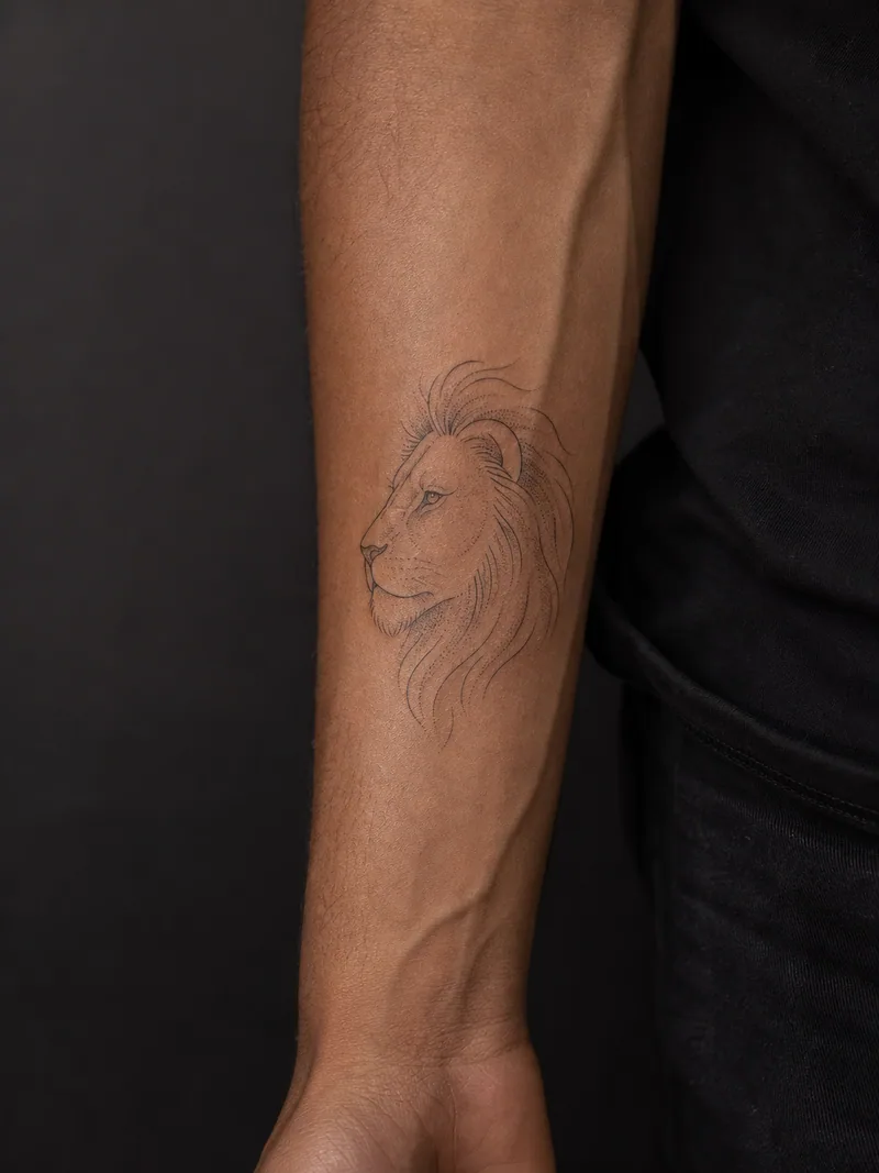 Fine line lion tattoo - a calm lion profile drawn with sparse contours and a lightly dotted mane